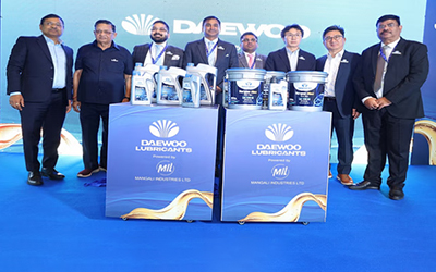 Daewoo team standing on a blue stage