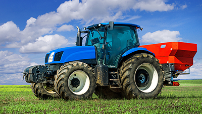 Blue tractor in field work