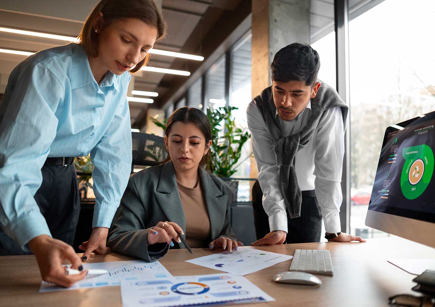 People analyzing checking finance graphs office